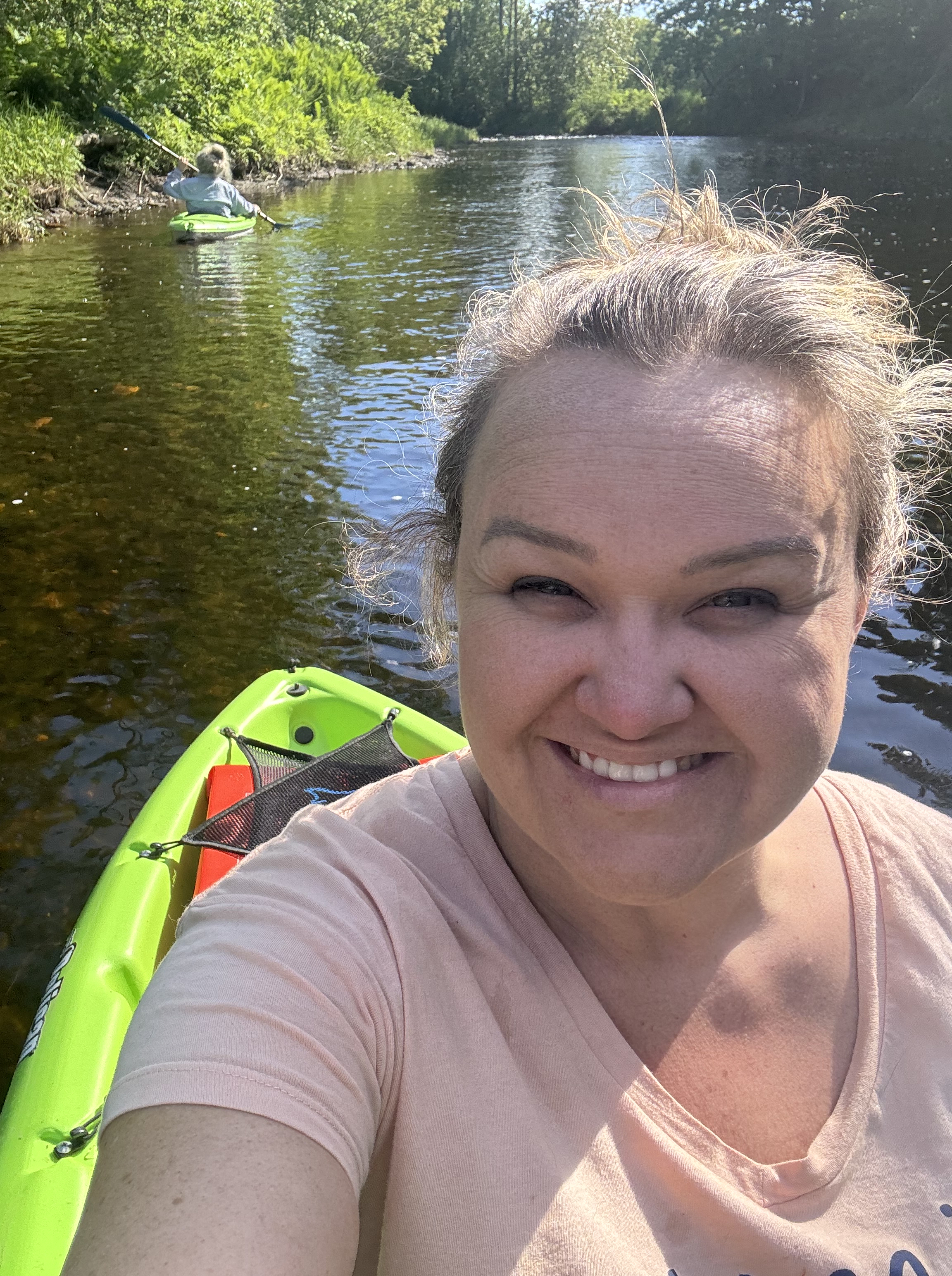 Woman kayaking near Houlton Maine as part of Riversbend Paddle Co. rental service